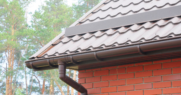 Roof slope and gutters on brick house